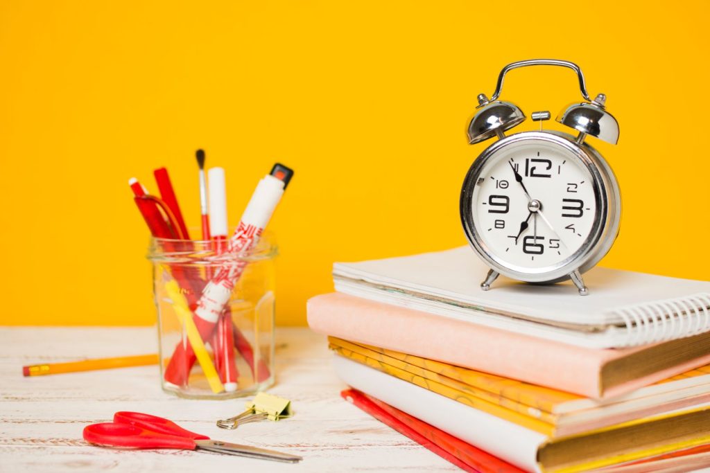 A clock showing 6:00 AM, with a to-do list and a peaceful environment to signify an early and organized start to the day